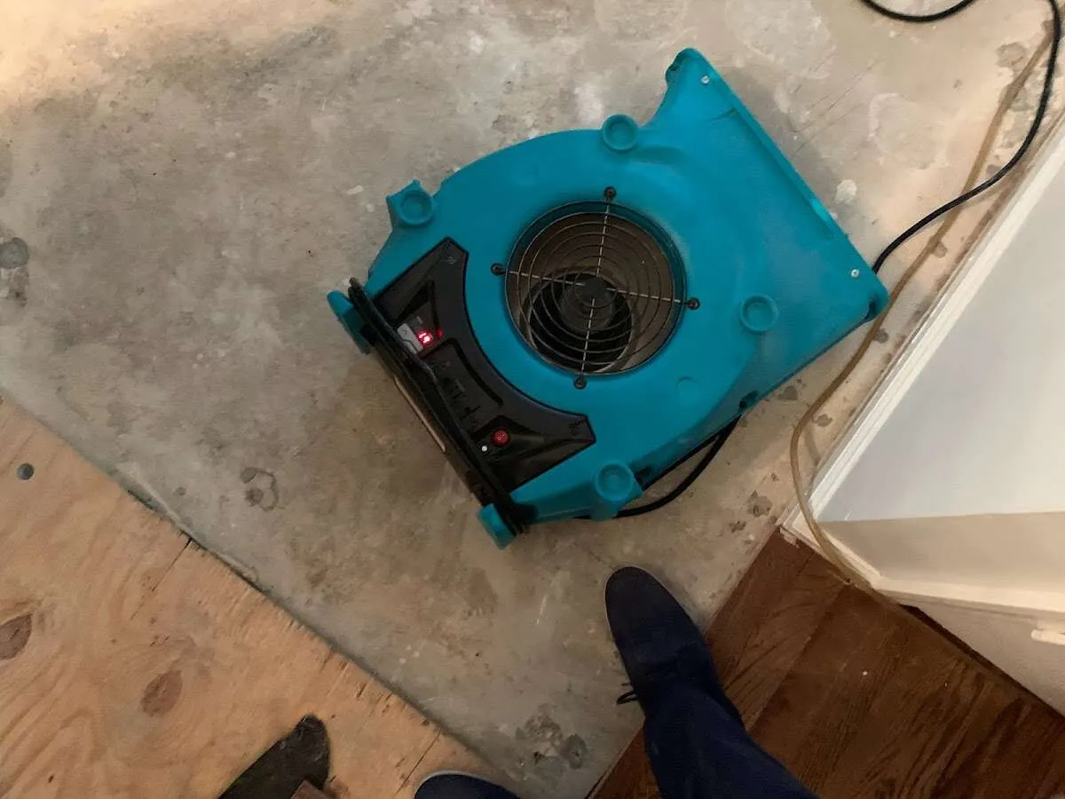 Air mover drying subfloor during Leak Detection & Repair in Destin